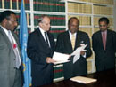 30 September 2003, Accession to the International Convention for the Suppression of Terrorist Bombings, United Nations Headquarters, New York: Mr. Rabbie L. Namaliu (second from right), Minister for Foreign Affairs of Papua New Guinea, acceding to the Convention, among other instruments.