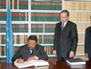 15 December 2004, Accession to the Convention on Contracts for the International Sale of Goods, United Nations Headquarters, New York: Mr. Jean Ping (Gabon, left), Minister for Foreign Affairs and President of the Fifty-ninth Session of the General Assembly acceding to the Convention, among other instruments. 
