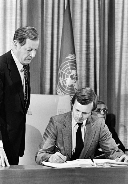 Signing of the Convention on Prohibitions or Restrictions on the Use of Certain Conventional Weapons Which May Be Deemed to Be Excessively Injurious or to Have Indiscriminate Effects, United Nations Headquarter, New York: Mr. Kornelius Johann Sigmundsson, Iceland's Deputy Permanent Representative to the United Nations, signing the Convention; and Mr. Philippe C. Giblain (left), Chief of the Untied Nations Treaty Section.
