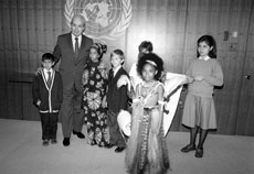 20 November 1989. Group of children meeting the Secretary-General, United Nations, New York. As the General Assembly adopts a Convention on the Rights of the Child, a group of children from the United Nations International School meets with Secretary-General Javier Perez De Cuellar.