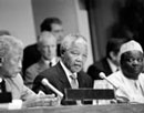 24 September 1993, Press conference by President Nelson Mandela, United Nations Headquarters, New York: Mr. Nelson Mandela (centre), President of the African National Congress of South Africa (ANC), addressing the correspondants; David Dinkins (left), Mayor of the City of New York; and Mr. Gambari (right), Chairman of the Special Committee against Apartheid. 