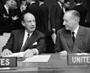 10 October 1962, First Committee, United Nations Headquarters, New York: The Committee begins its discussion of the agenda item entitled “The urgent need for cessation of nuclear and thermonuclear tests and conclusion of a treaty designed to achieve a comprehensive test ban.” Mr. Adlai Stevenson (United States), at left, conversing with Sir Michael Wright (United Kingdom), to his right.