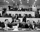 18 November 1957 Twelfth Session of the General Assembly, meeting of the Sixth Committee, United Nations Headquarters, New York (from left to right): Mr. Hashim Khalil (Iraq); Mr. Ahmad Eghbal (Iran); and Mr. Imron Rosjadi (Indonesia) while the Sixth Committee continues the discussion of proposals on the definition of aggression. 