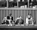 4 November 1974 Twenty-ninth Session of the General Assembly, Fourth Committee (Trust and Non-Self-Governing Territories), United Nations Headquarters, New York (sitting at the table, from left to right): Mr. Tang Ming Chao, Under-Secretary-General for Political Affairs, Trusteeship and Decolonization; Mr. Buyantyn Dashtseren (Mongolia), Chairman; and Mr. Najmuddine Rifai, Committee Secretary