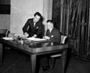 30 April 1958, United Nations Conference on the Law of the Sea, Geneva, Switzerland: Mr. Emile de Curton (left), Permanent French Representative to the United Nations European Office, signing, and Mr. Derek W. Bowett, United Nations Legal Officer (right), after the signature of the Final Act of the Conference and the opening for signature of the four international conventions 