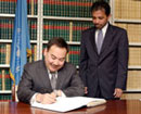 02 December 2003 United Nations Headquarters, New York: Mr. Yerzhan Kh. Kazykhanov (left), Permanent Representative of the Republic of Kazakhstan to the United Nations, signing the International Covenant on Civil and Political Rights and the International Covenant on Economic, Social and Cultural Rights.