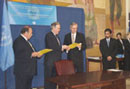 23 September 2003, Ratification of the International Convention for the Suppression of the Financing of Terrorism, United Nations Headquarters, New York: Mr. Roy Chaderton-Matos (second from left), Minister for Foreign Affairs of Venezuela, ratifying the Convention, among other instruments; standing at his left is Mr. Hans Corell, Under-Secretary-General for Legal Affairs and United Nations Legal Counsel.