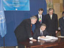 25 September 2003, Ratification of the International Convention for the Suppression of Terrorist Bombings, United Nations Headquarters, New York: Mr. Nestor Carlos Kirchner (seated), President of Argentina, ratifying the Convention, among other instruments.