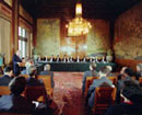 17 November 1993, Inauguration of the International Criminal Tribunal for the former Yugoslavia, Peace Palace, The Hague, The Netherlands: Mr. Carl-August Fleischhaure (left, behind podium), Under-Secretary-General for Legal Affairs, opening the meeting of the Tribunal next to the 11 judges of the Tribunal seating behind the table.