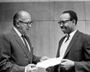 6 January 1969 , Accession of Botswana to the Convention and Protocol relating to the Status of Refugees, United Nations Headquarters, New York: Mr. C. A. Stavropoulos (left), United Nations Legal Counsel, receiving the instruments of accession to both instruments from Ambassador T. J. Molefhe, Permanent Representative of Botswana to the United Nations. 