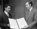 22 February 1974 Accession of Sudan to the Convention and Protocol relating to the Status of Refugees, United Nations Headquarters, New York: Mr. Erik Suy (right), Under-Secretary-General for Legal Affairs and Legal Counsel of the United Nations, receiving the instruments of accession from Mr. Izzeldin Hamid, Minister Plenipotentiary, Permanent Mission of the Democratic Republic of the Sudan to the United Nations. 