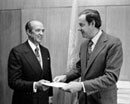 26 April 1978 Accession of Panama to the Convention and Protocol relating to the Status of Refugees, United Nations Headquarters, New York: Ambassador Jorge E. Illulga (left), Permanent Representative of Panama to the United Nations, presenting the instrument of accession to Mr. Erik Suy, Under-Secretary-General for Legal Affairs and Legal Counsel of the United Nations. 
