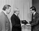 18 March 1983 Accession of Mexico to the Convention on the Law of the Sea, United Nations Headquarters, New York (from right to left): Mr. Bernardo Sepulveda Amor, Foreign Minister of Mexico, presenting the instrument of ratification to Secretary-General Javier Perez de Cuellar, next to Mr. Carl-August Fleischhauer, United Nations Legal Counsel. 