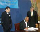 24 September 2003, Accession of Jamaica  to the amendments to the Montreal Protocol on Substances that Deplete the Ozone  Layer, 1997 and 1999, United Nations Headquarters, New York: Mr. K.D. Knight (seated), Minister  for Foreign Affairs and Foreign Trade of Jamaica depositing the instrument of ratification of the amendments to the Protocol;  to his right is Mr. Hans Corell, Under-Secretary-General for Legal Affairs and  Legal Counsel.
