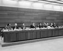 5 May 1975, Twenty-seventh Session of the International Law Commission at which the Commission accorded priority to the question of succession of States in respect of matters other than treaties, Palais des Nations, Geneva: at the presiding table (from left to right) Mr. Alfredo Martinez-Moreno (El Salvador), Rapporteur; Mr. Robert Quentin-Baxter (New Zealand), Chairman of the Drafting Committee; Mr. Mohammed Bedjaoui (Algeria), First Vice-Chairman; Mr. Erik Suy, Under-Secretary General for Legal Affairs and Legal Counsel; Mr. Abdul Hakim Tabibi (Afghanistan), Chairman; and Mr. Nicolas Teslinko, Secretary of the Commission.