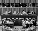 22 October 1975, Thirtieth Session of the General Assembly at which the debate continued in the Sixth Committee on the report of the International Law Commission containing draft articles on succession of States in respect of treaties, United Nations Headquarters, New York: at the presiding table are (from left to right) Mr. Abdul Hakim Tabibi (Afghanistan), Chairman of the International Law Commission; Mr. Frank X. Njenga (Kenya), Committee Chairman; Mr. Yuri M. Rybakov (USSR), Committee Secretary; and Mr. Eike Bracklo (Federal Republic of Germany), Rapporteur.